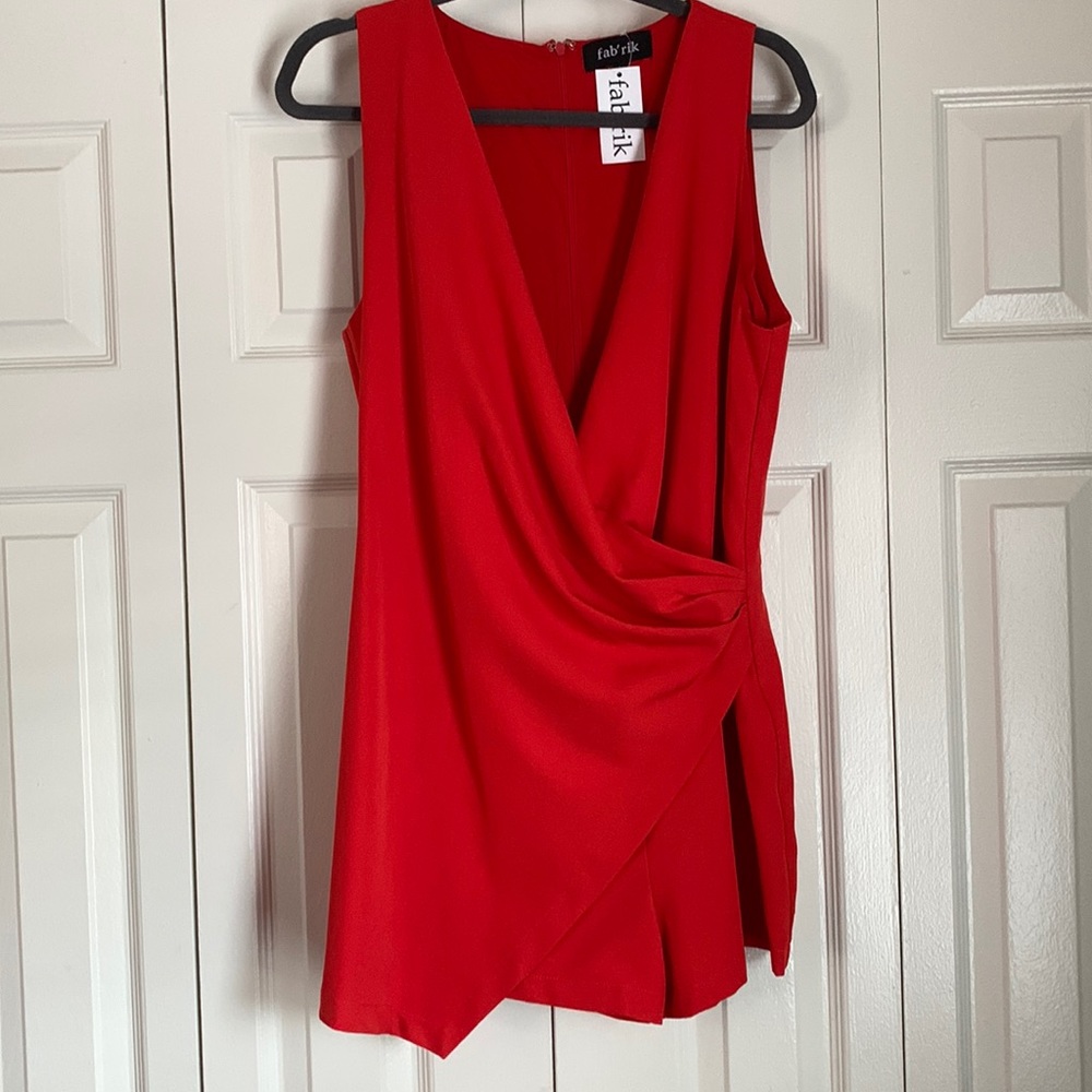 Coral colored romper, size medium from Fabrik.